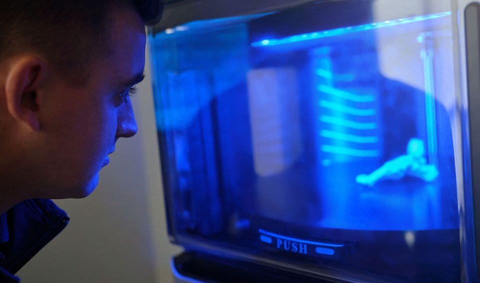 A doctor viewing research materials on computer screen