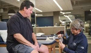 The therapist explaining about Joint Replacement Education Carmel