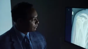 A doctor at Forté Sports Medicine and Orthopedics reviewing a shoulder x-ray in Indiana