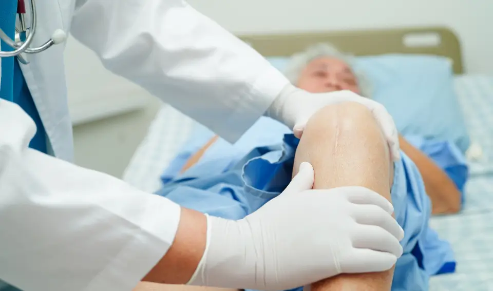 A patient being examined for knee replacement surgery in Central Indiana