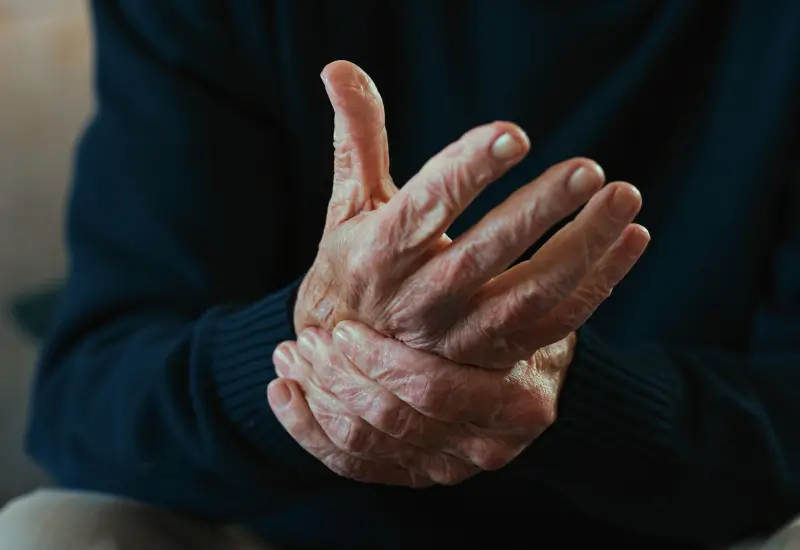 A person experiencing arthritis pain in Central Indiana