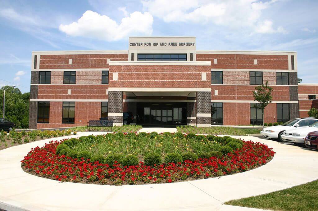Premier Orthopedic Care building in Mooresville with a circular flower bed in front