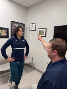 A man and woman discuss sports-related concussions at Forte Sports Medicine