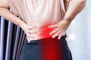 woman suffering from buttocks and lower back pain, Sciatica Pain concept